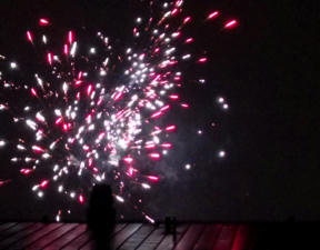 Fireworks above a roof